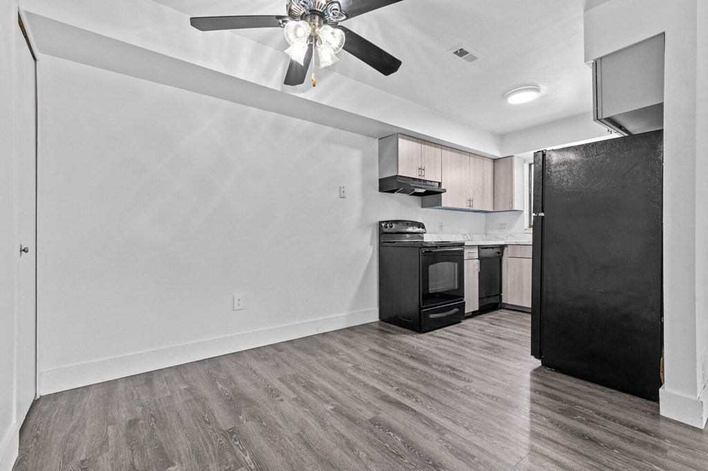 a kitchen and living room in a 555 waverly unit