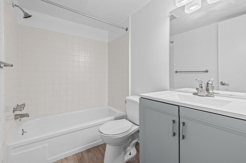 a bathroom with a sink toilet and a bath tub