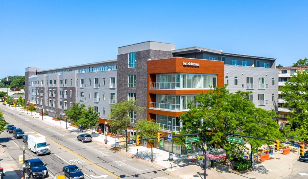a large building on the corner of a city street