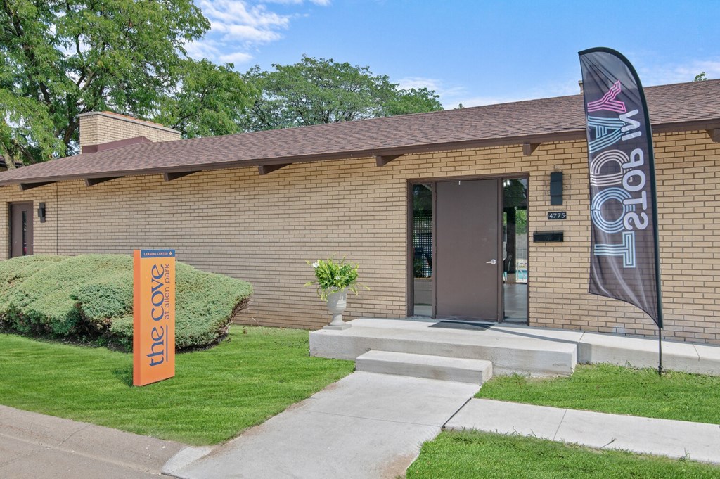 a brick building with a flag in front of it