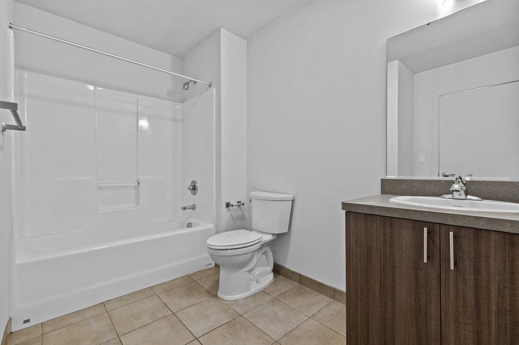 a bathroom with a toilet sink and bathtub