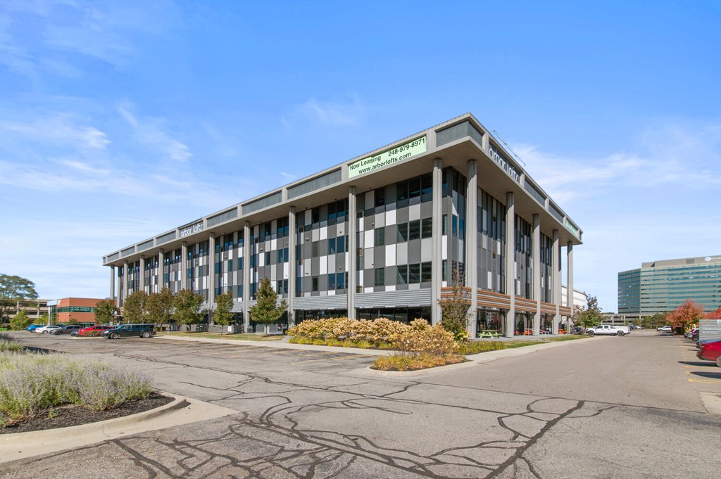 a large office building with a street in front of it