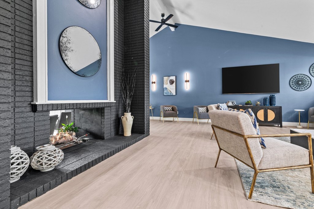 a living room with blue walls and a fireplace