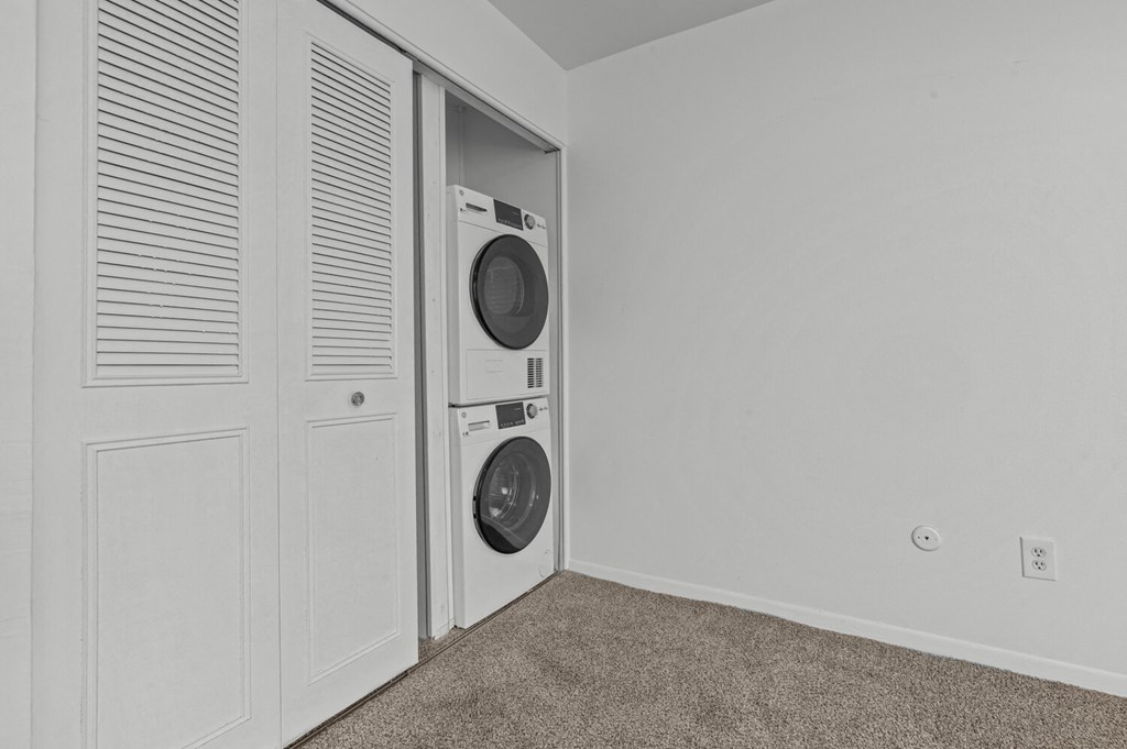 a washer and dryer in a closet in a home