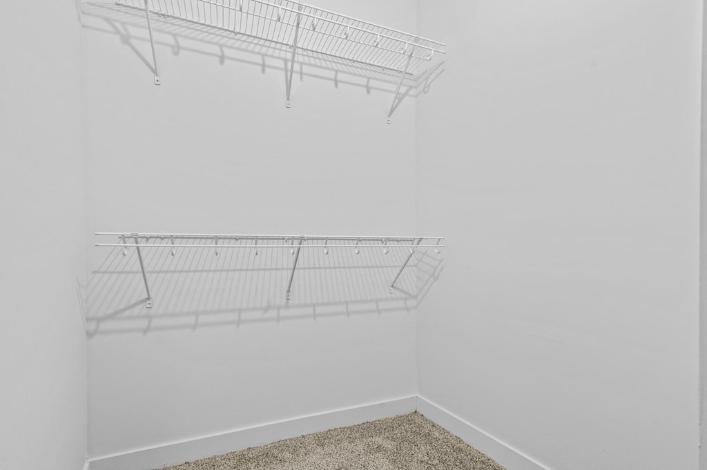 a walk in closet in a 555 waverly unit