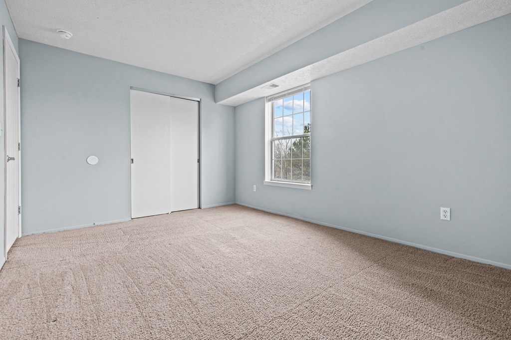 Carpeted Bedroom at Fairfax Apartments - Lansing, MI, Lansing, MI, 48917