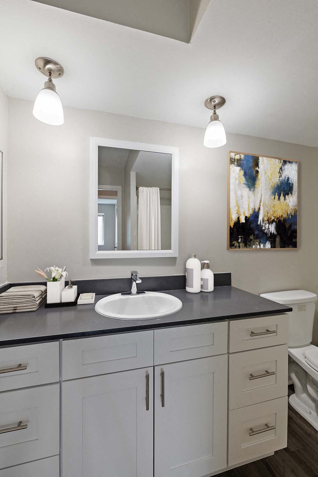 a white bathroom with a sink and a mirror