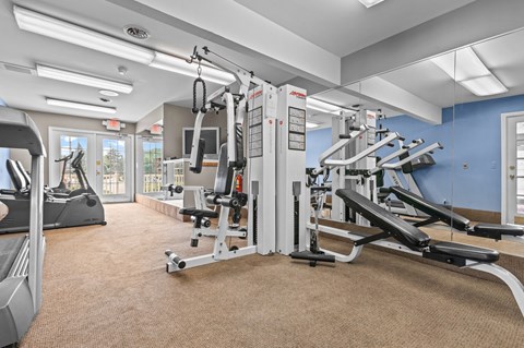 a fitness center with cardio equipment and exercise machines