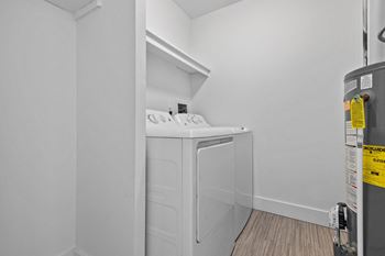 a laundry room with a washer and dryer