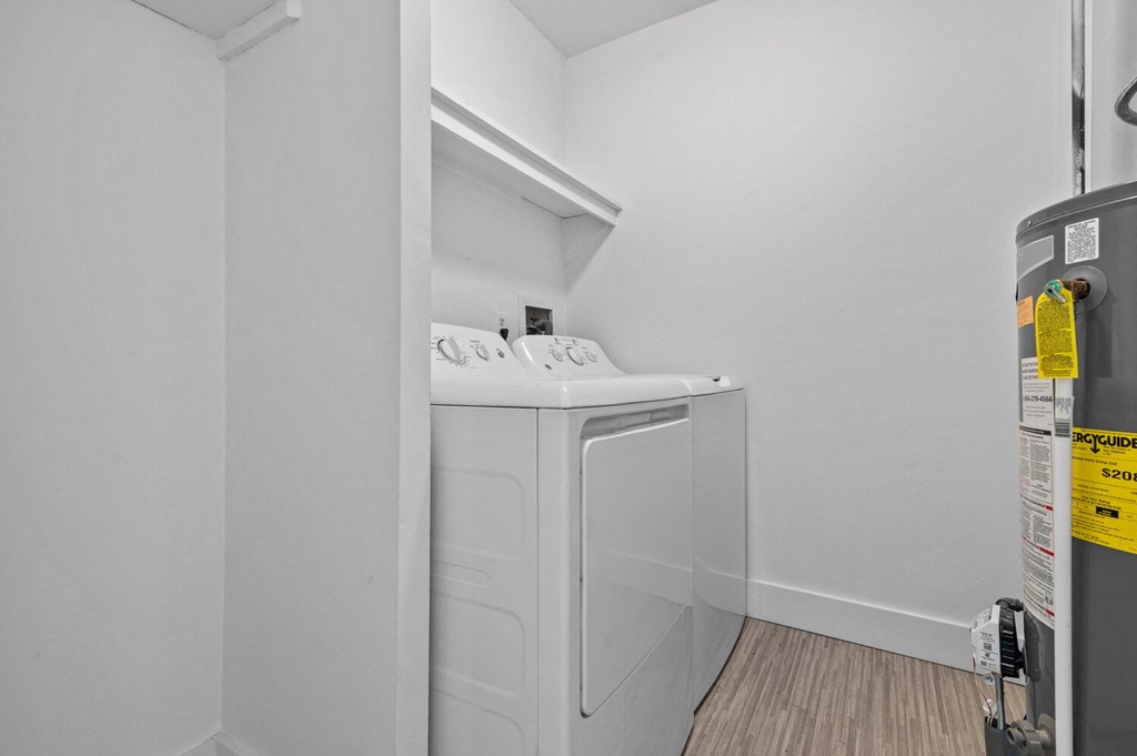a laundry room with a washer and dryer