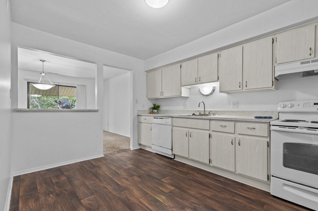 an empty kitchen with white appliances and white cabinets at Edge At Farmington Hills - Farmington Hills, MI, Farmington Hills, 48334