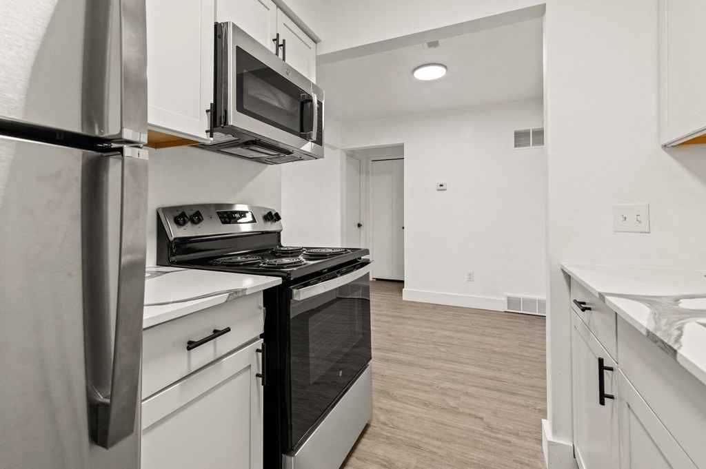 Fully Equipped Kitchen Includes Frost-Free Refrigerator, Electric Range, & Dishwasher  at Park On Canal Apartments, Clinton Twp, Michigan