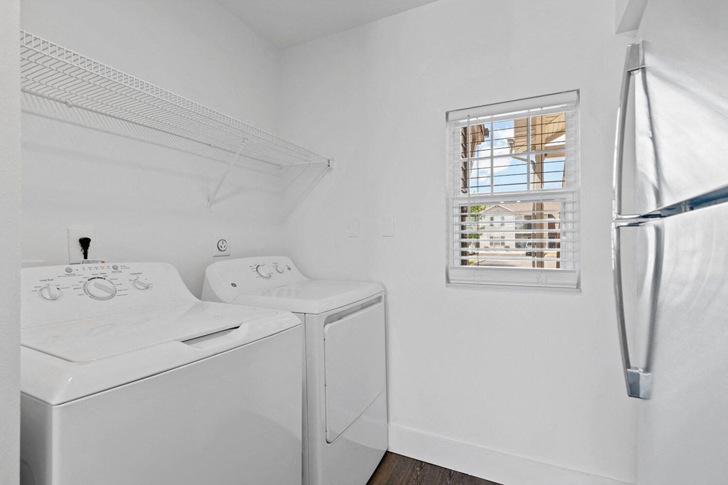 a laundry room with a washer and dryer