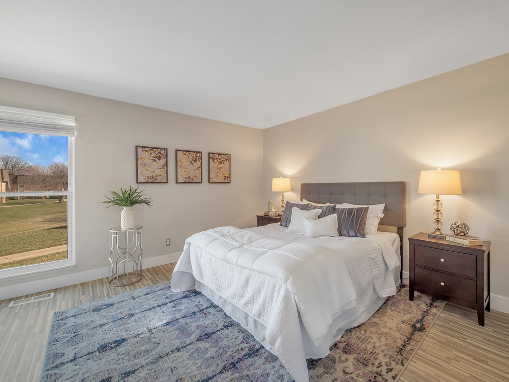 Bedroom With Expansive Windows at Rochester Club Apartments - Rochester, MI, Michigan, 48306