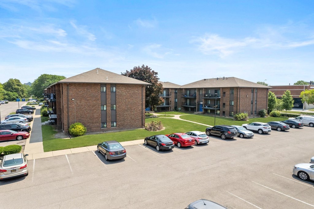 a large brick building with a parking lot in front of it at Lafayette Park Place, Detroit, MI, Detroit, MI