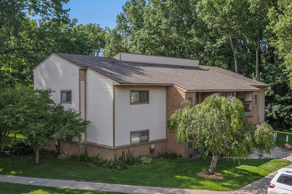 an aerial view of a brick and with trees