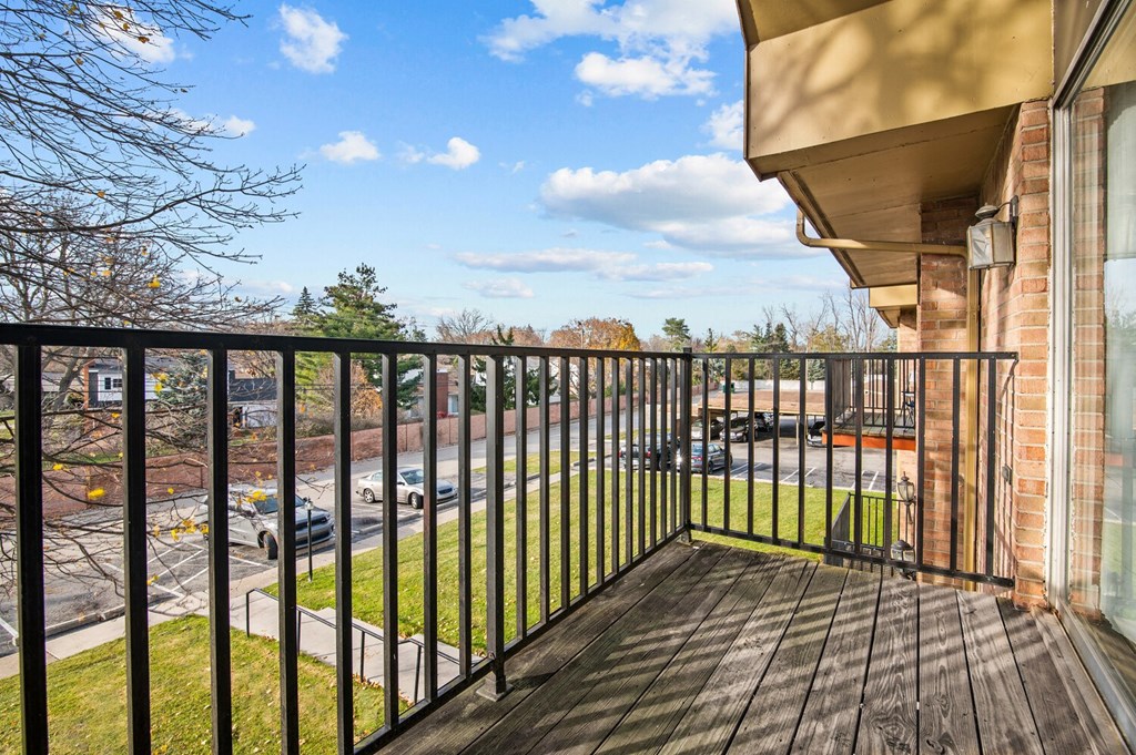 the view from the balcony of a home with a balcony railing