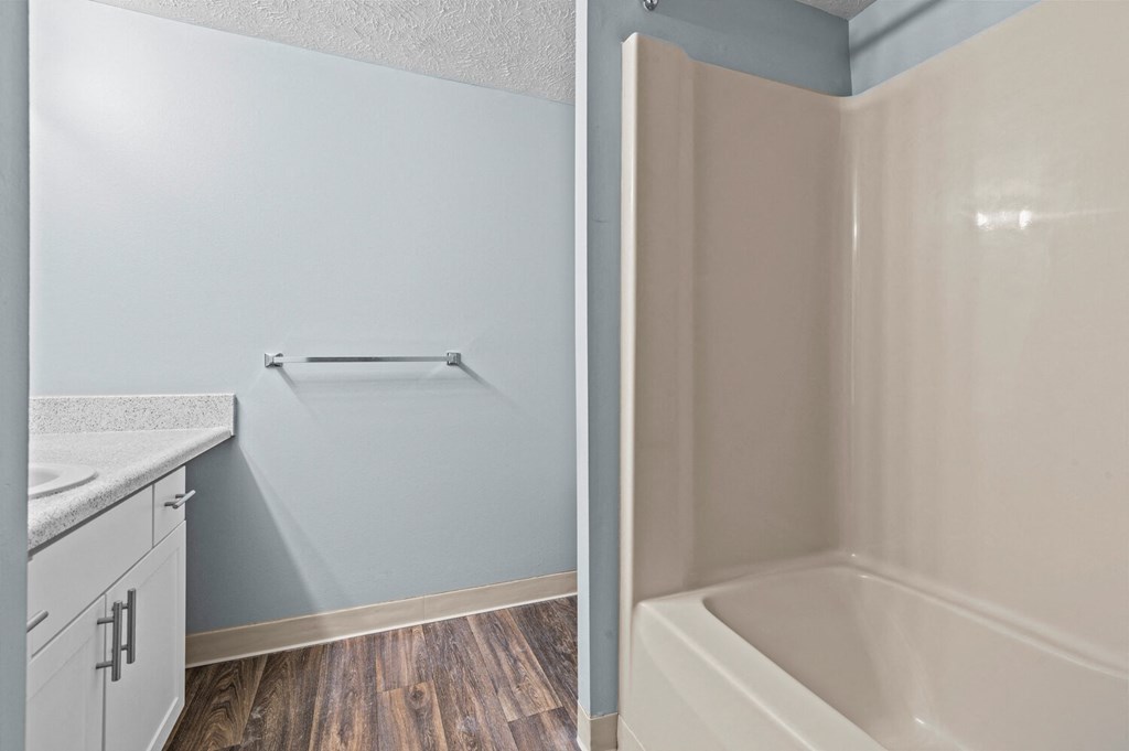 the preserve at ballantyne commons apartment bathroom with tub and sink  at Fairfax Apartments - Lansing, MI, Michigan