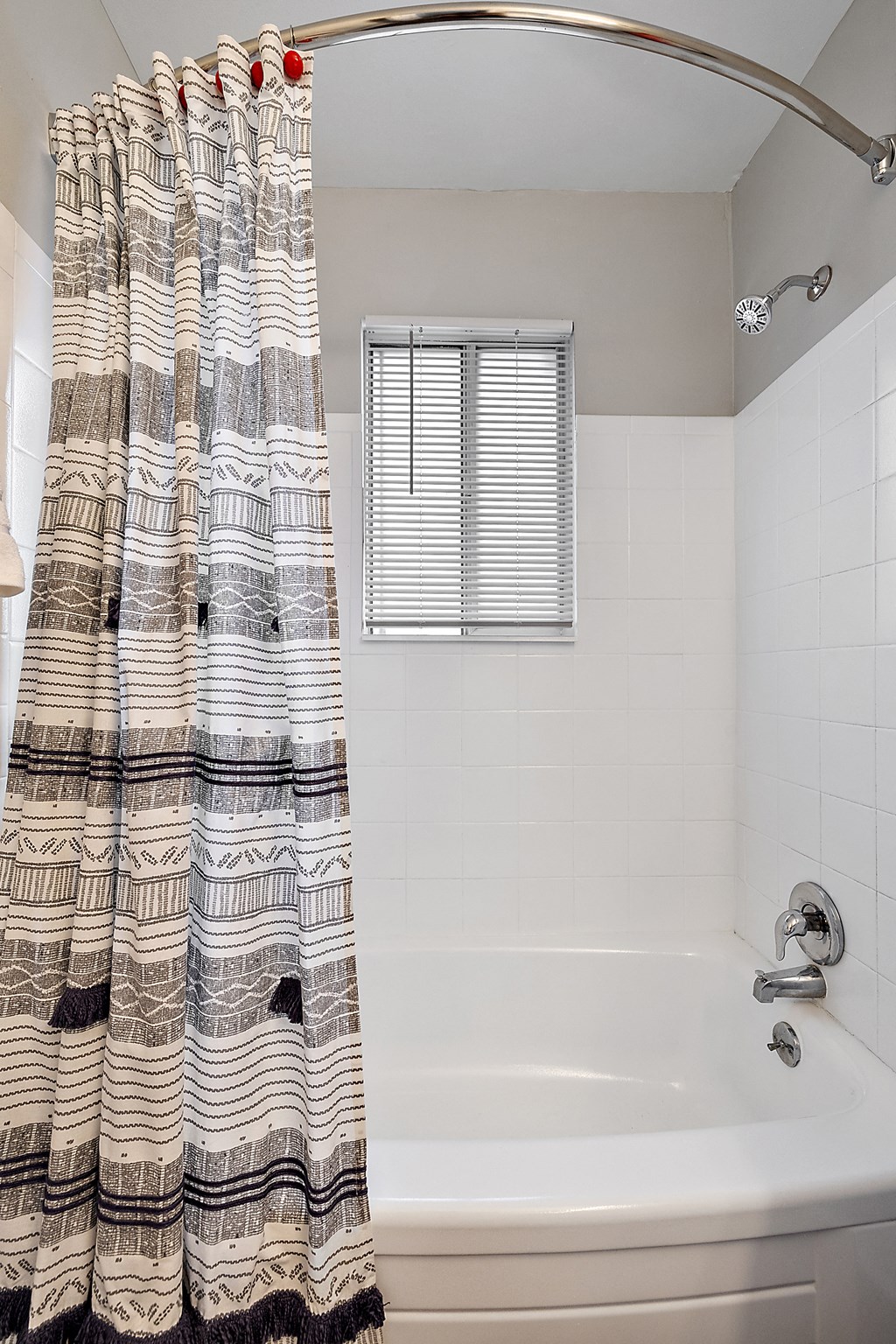 a bathroom with a bath tub and a shower curtain