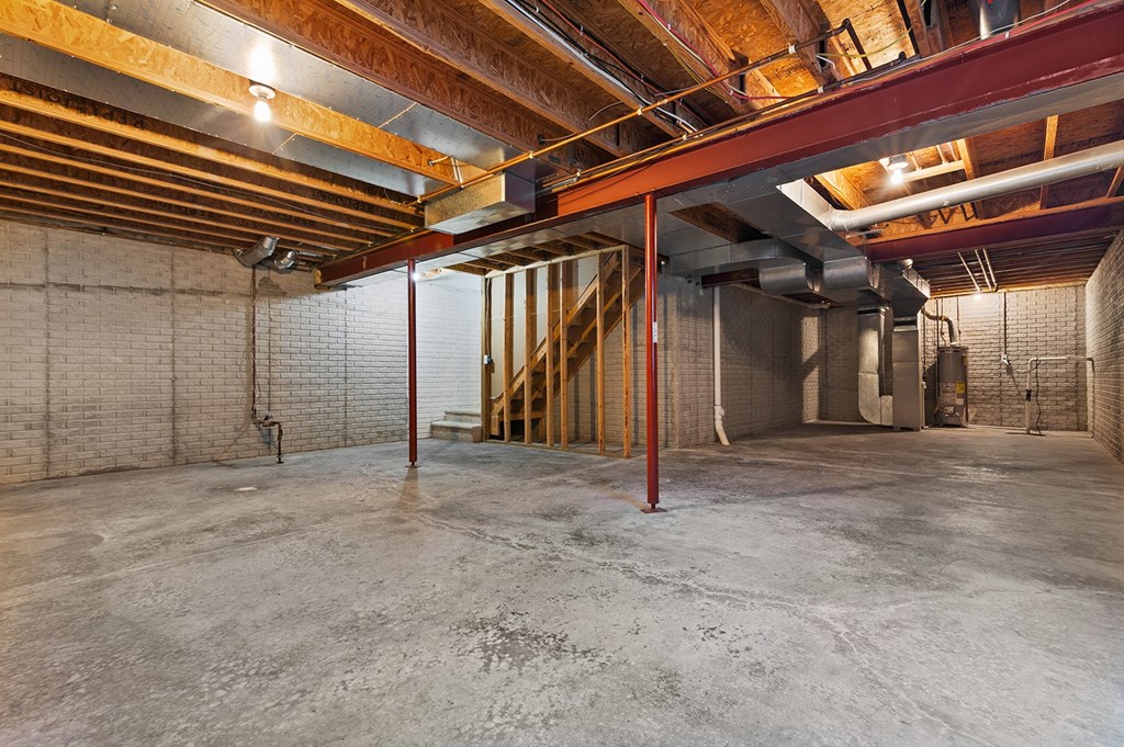 the interior of a warehouse with a staircase in the middle