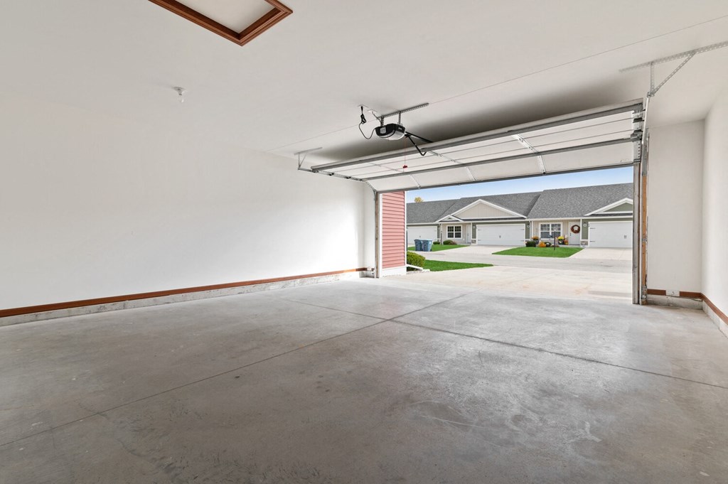 the garage of a home with a garage door open