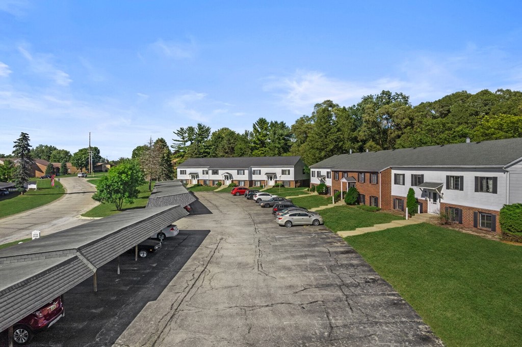 a view of a neighborhood with houses and a parking lot