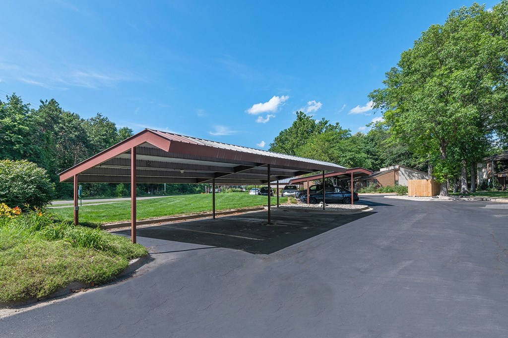 a parking lot with a covered pavilion