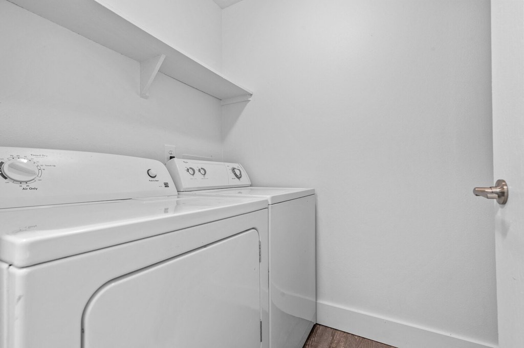 a laundry room with a washer and dryer