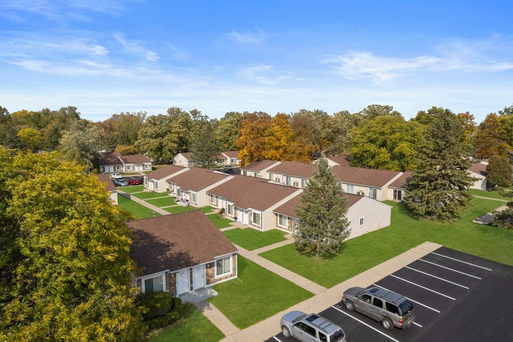 an aerial view of a neighborhood with houses and trees