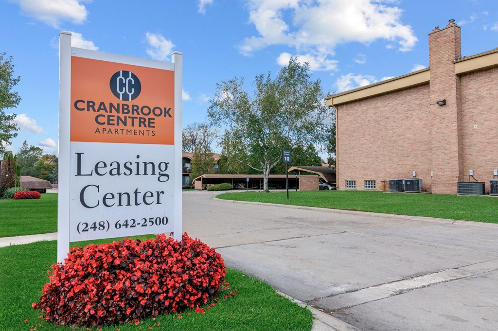 a sign in front of a building