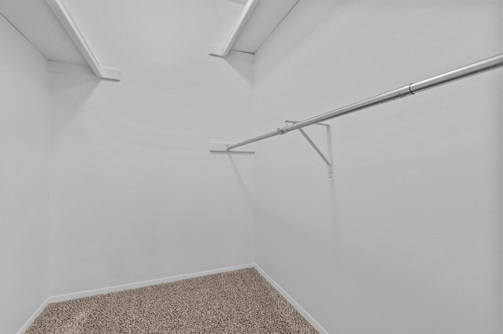 an empty room with white walls and a closet in the corner at Edge At Farmington Hills - Farmington Hills, MI, Farmington Hills, Michigan