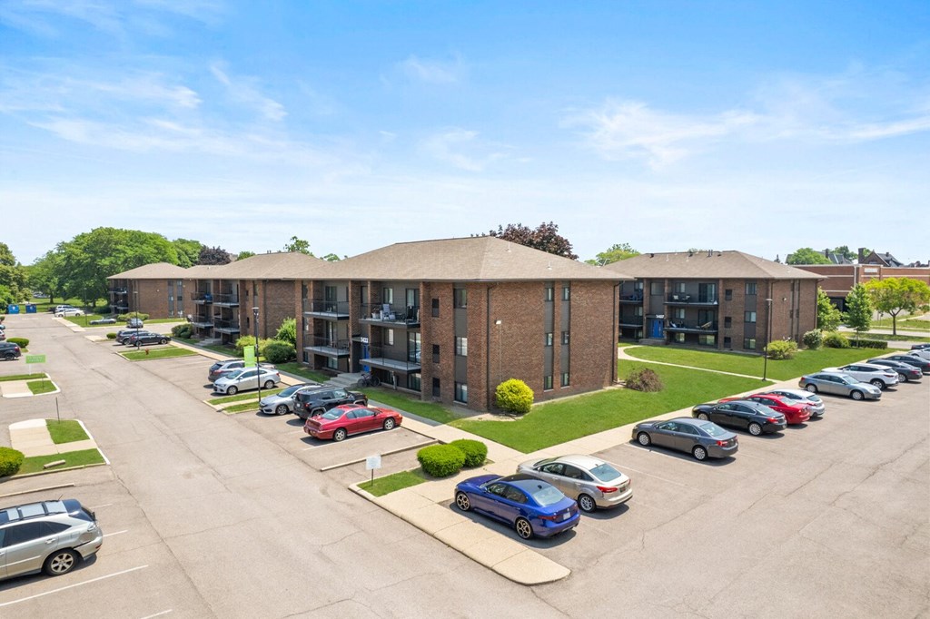 a brick apartment building with a parking lot in front of it at Lafayette Park Place, Detroit, MI, Detroit, MI, 48207