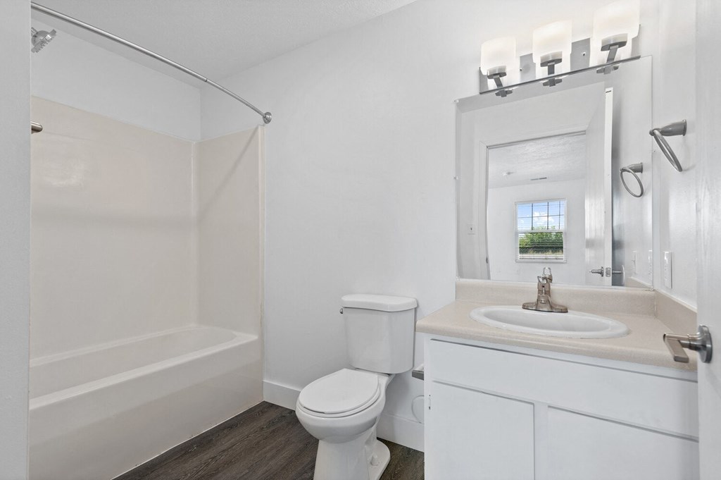 a bathroom with a bathtub and a sink