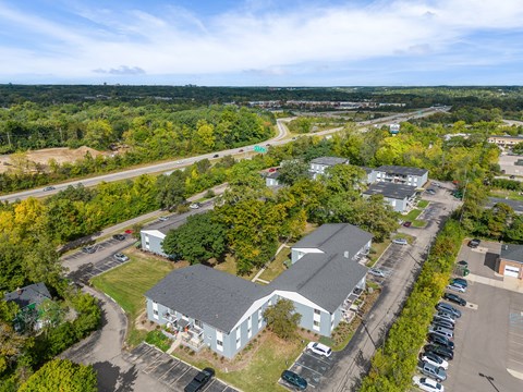 A large building with a parking lot in front of it.
