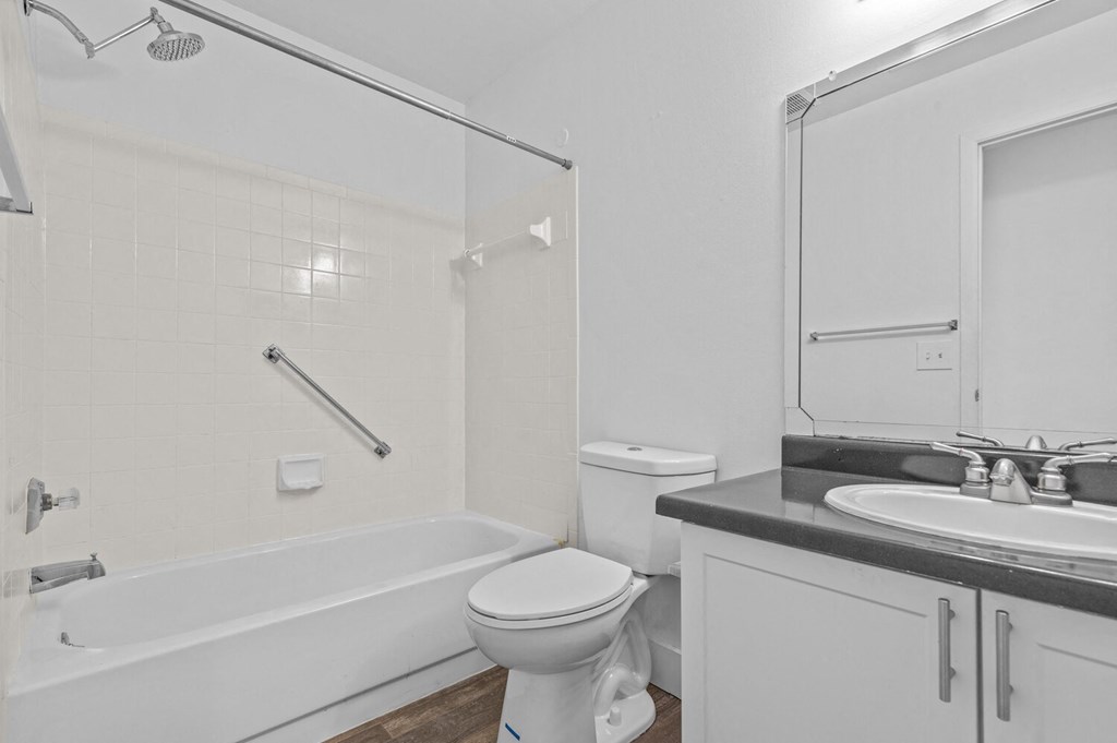 a bathroom with a toilet sink and bathtub