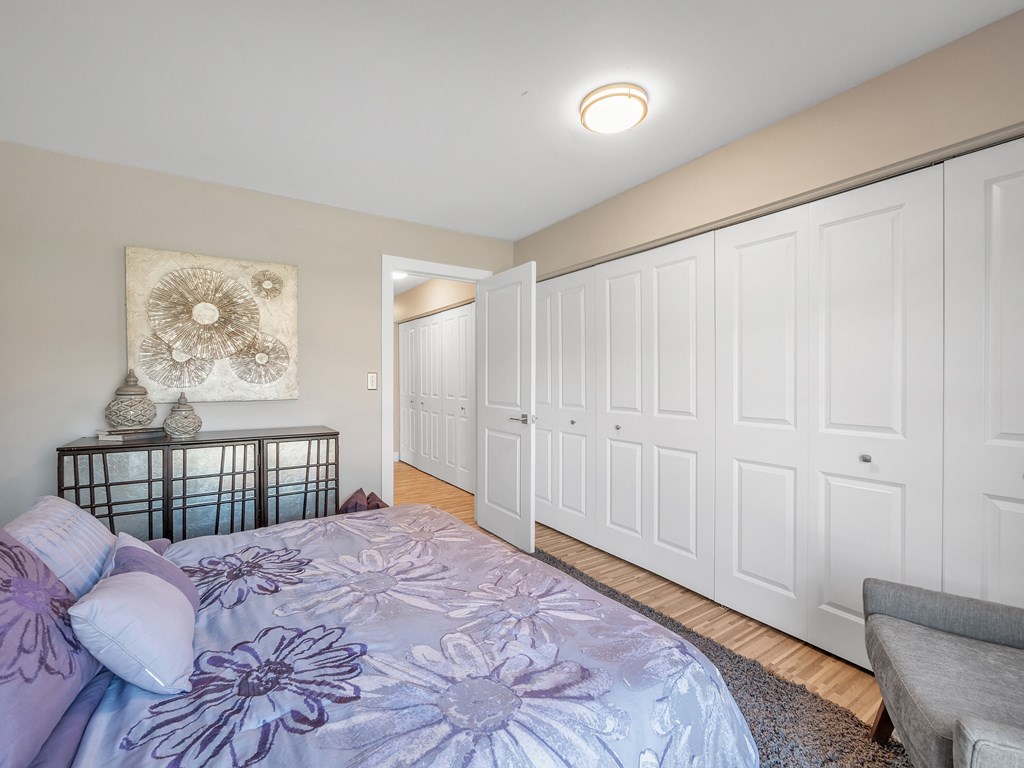 Bedroom With Closet at Rochester Club Apartments - Rochester, MI, Rochester Hills, Michigan