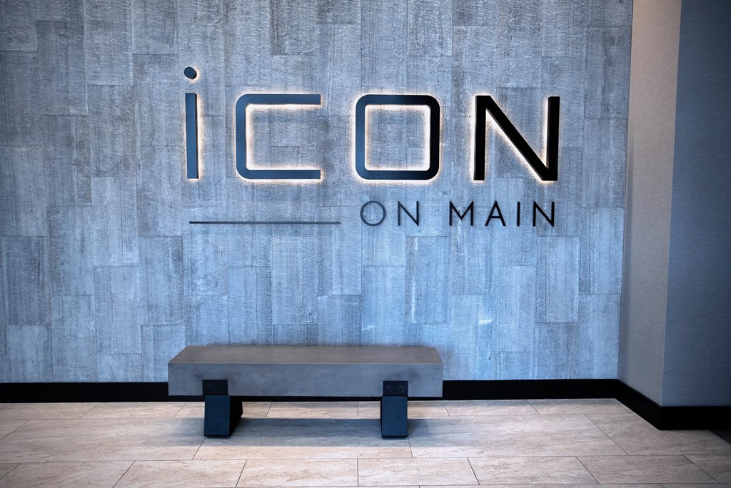 a bench in front of a sign for icon on main