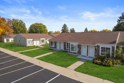 a row of houses in a neighborhood with a parking lot