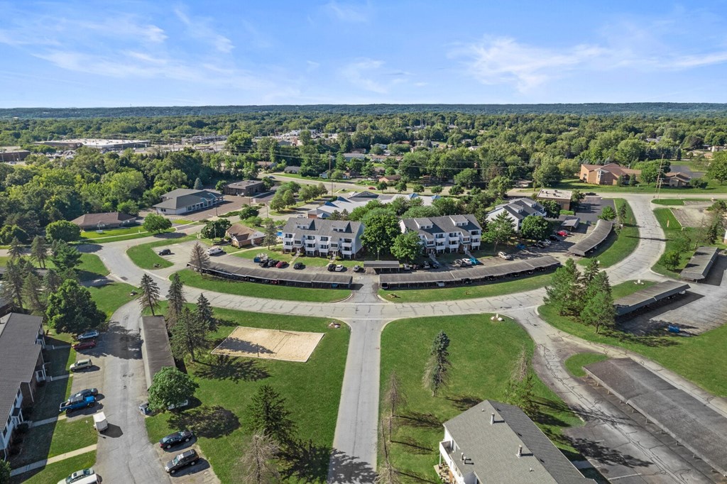 an aerial view of a neighborhood with houses and roads