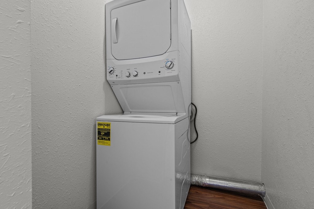 a washer and dryer in the corner of a room