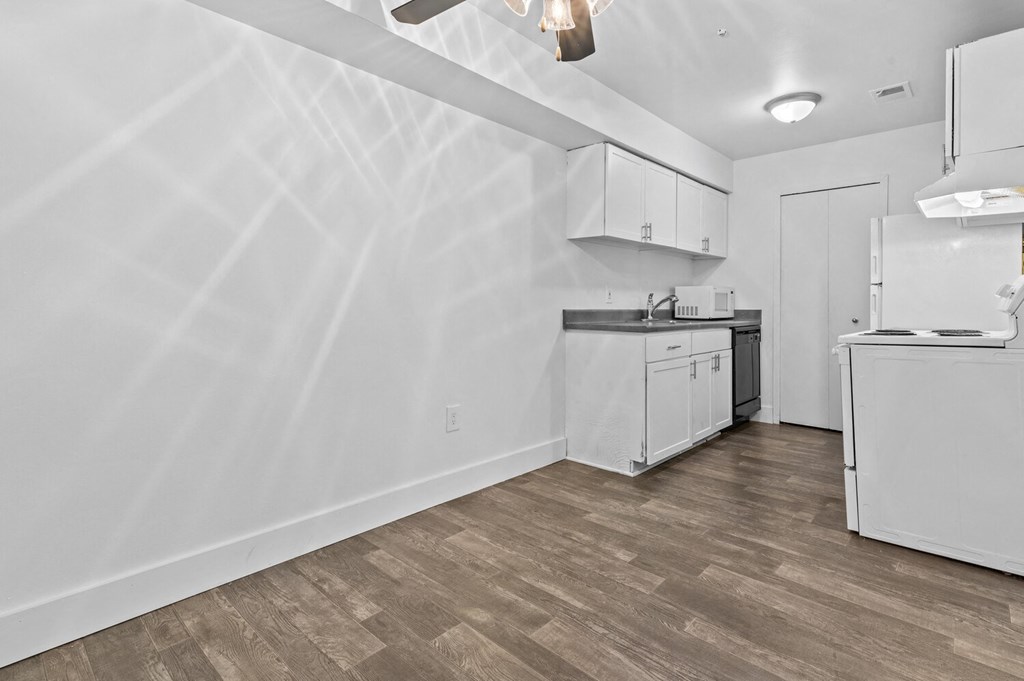 a kitchen and living room in a 555 waverly unit