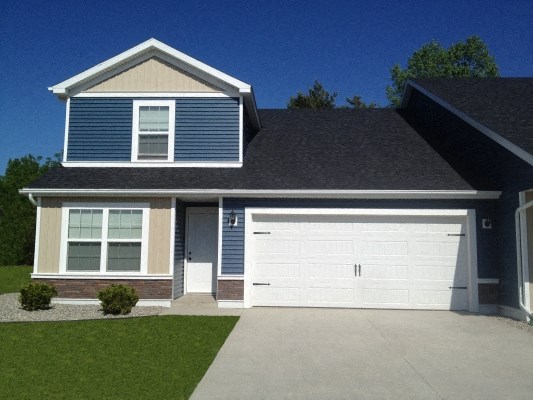 a house with a white garage door in front of it