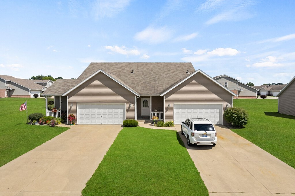 a house with a car parked in the driveway