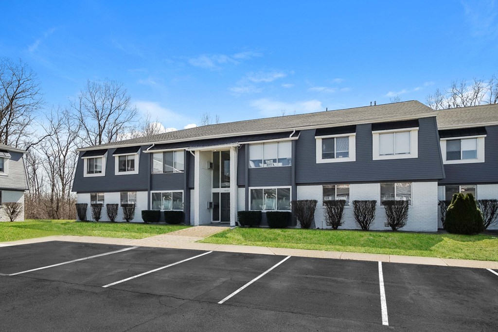 a building with a parking lot in front of it