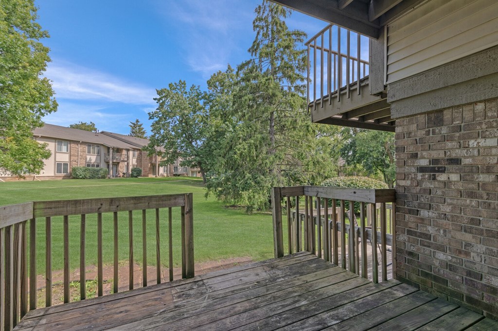 the view of a yard from the balcony of a house at Edge At Farmington Hills - Farmington Hills, MI, Michigan, 48334