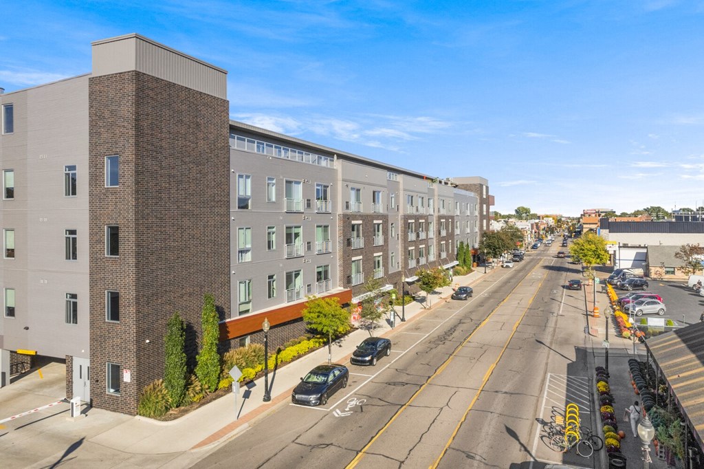 a large brick building on the corner of a city street