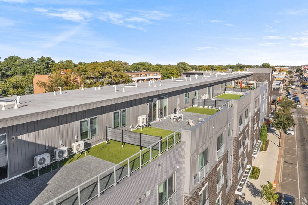 an aerial view of a building with a green roof