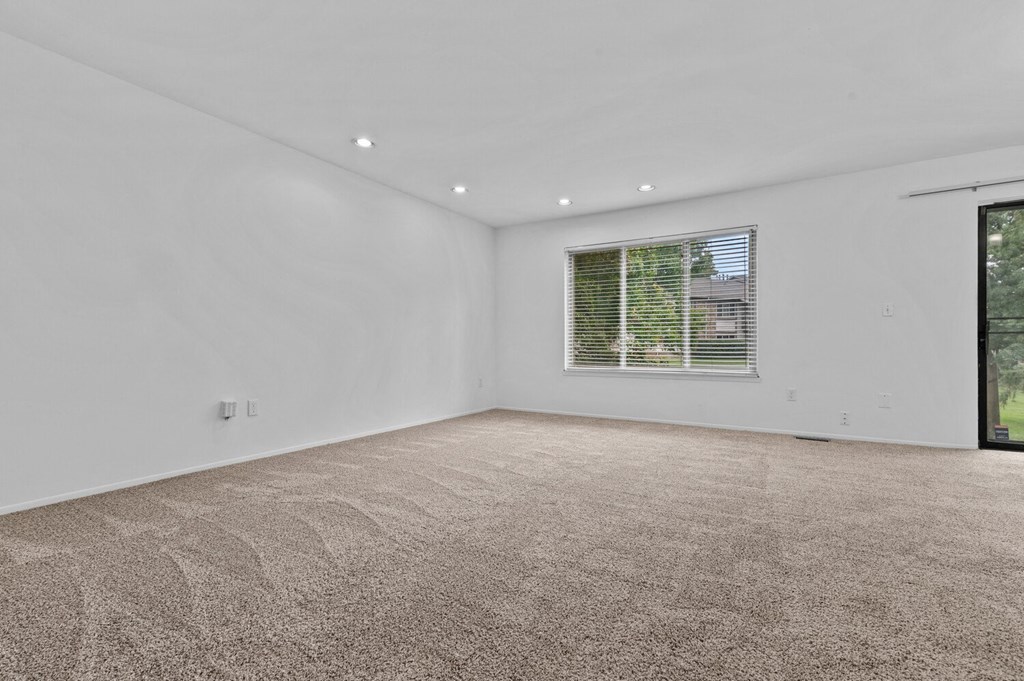 a white room with a window and a carpeted floor at Edge At Farmington Hills - Farmington Hills, MI, Michigan