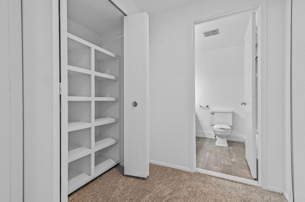 a white bathroom with a white toilet and a white closet at Edge At Farmington Hills - Farmington Hills, MI, Michigan