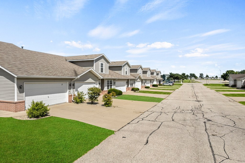 a row of houses on the side of a street